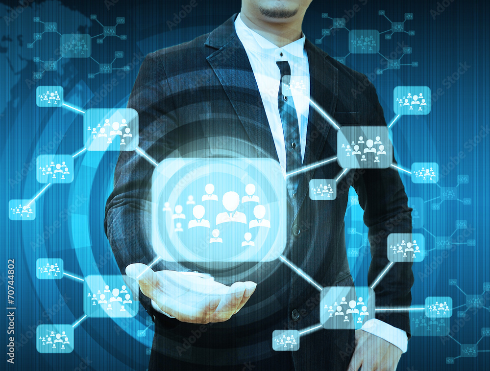 Wall mural businessman holding icon of social network