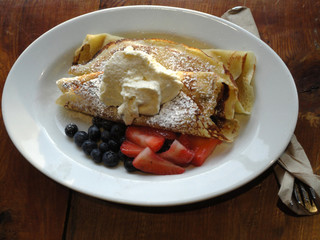 Sweet Crepes Served with sugar ice cream, blueberries and Strawb