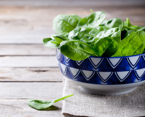 Baby spinach in a blue ceramic bowl