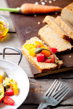 Red and yellow fresh tomato salad with bread