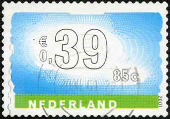 Stamp of the Netherlands with an abstract, colour background