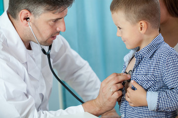 Pediatrician listening preschooler heart