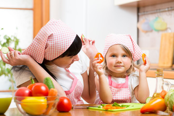 mom and kid preparing healthy food