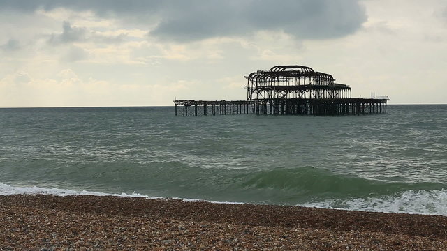 Waves crashing against the beach at West PIer in Brighton