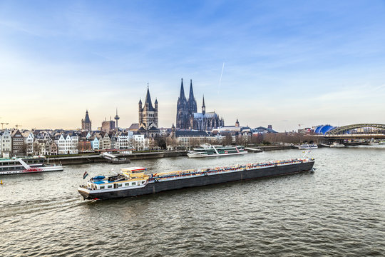 Sunrise In Cologne With Dome And River Rhine