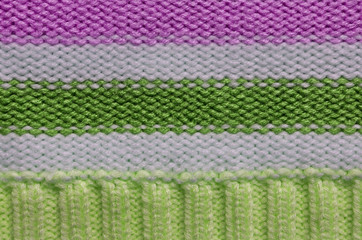 Knit woolen texture. Fabric striped background