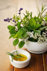 Fototapeta na wymiar Fresh rosemary in olive oil and herb bouquet