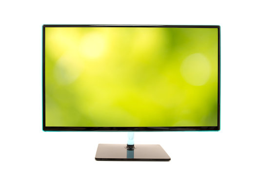 Monitor with an image of a blurred green natural background