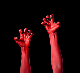 Red devil hands with black nails, real body-art