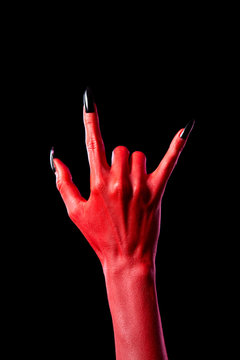 Devil hand showing heavy metal gesture