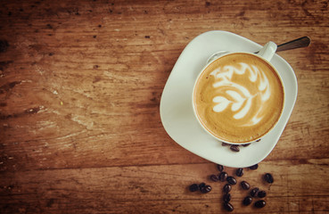 Cup of art latte or cappuccino coffee