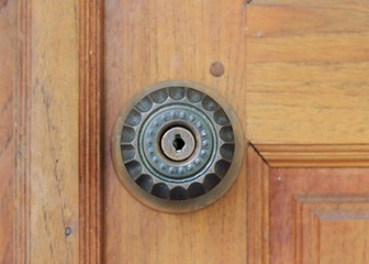 keyhole door handle on brown wood door