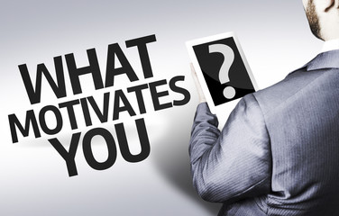 Business man with the question What Motivates You?