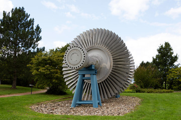 Steam turbine of nuclear power plant against a sky