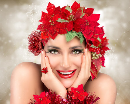 Happy Christmas Girl. Beautiful Woman in red. Holiday Hairstyle