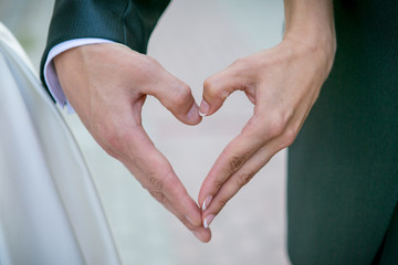 Hands of bride and groom