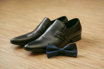 Bow tie and man's shoes
