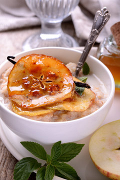 vanilla porridge of oatmeal with honey caramel apples slices