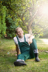 Gardener sitting on the grass