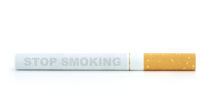 Cigarette with stop smoking text isolated on white background