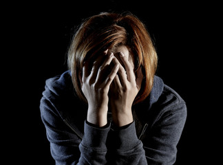 close up woman suffering depression and stress alone in pain