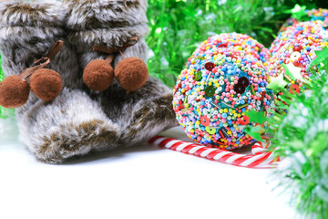 Green tinsel with snow boots decoration