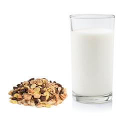 pile of muesli and fresh milk in the glass isolated on white bac