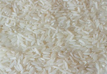 White long rice background, uncooked raw cereals, raw rice grain