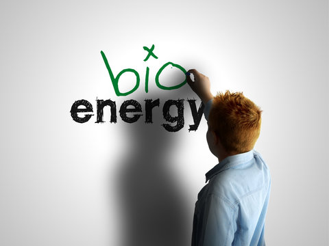 Bio energy. Boy writing on a white board
