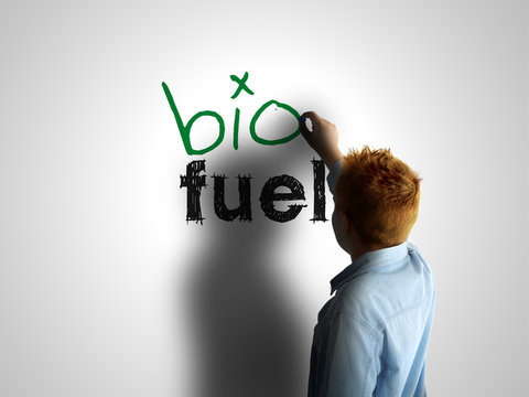Bio fuel. Boy writing on a white board