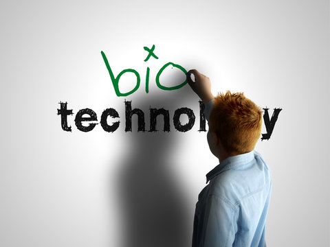 Bio technology. Boy writing on a white board