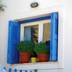 Greece, Milos island, window and flower pots