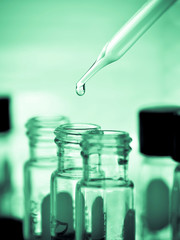 Laboratory research, dropping liquid to test tube