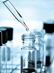 Laboratory research, dropping liquid to test tube