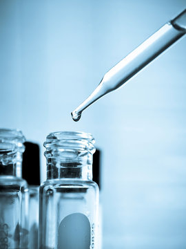 Laboratory research, dropping liquid to test tube