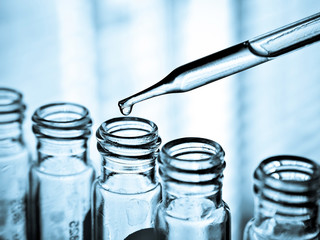 Laboratory research, dropping liquid to test tube