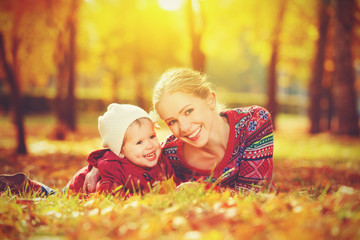 happy family: mother and child little daughter  in  autumn