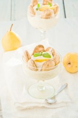 Dessert with pears, creamy cream and cookies