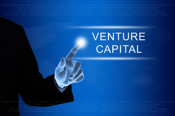 business hand clicking venture capital button on touch screen