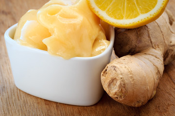 ginger root, honey and lemon on wooden rustic table.