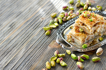 Turkish pistachio pastry dessert  baklava with green pistachios - 70787619