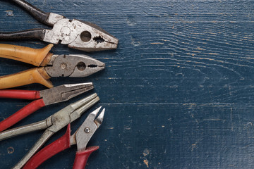 pliers on blue table