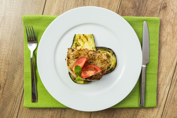 Grilled Egg Plant Slice With Pork Steak And Sliced Tomatoes