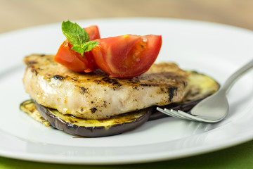 Grilled Egg Plant Slice With Pork Steak And Sliced Tomatoes