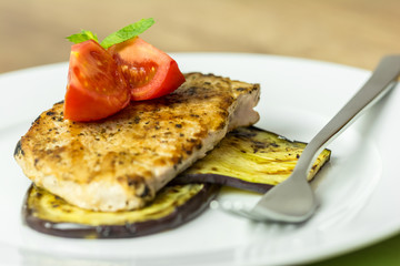 Grilled Egg Plant Slice With Pork Steak And Sliced Tomatoes