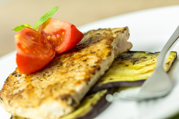 Grilled Egg Plant Slice With Pork Steak And Sliced Tomatoes