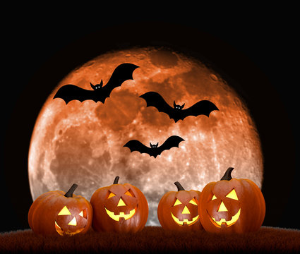 Halloween background scene with full moon, pumpkins and bats