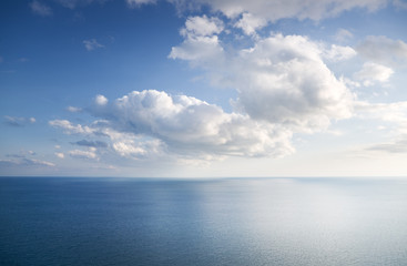 Naklejka na ściany i meble Blue sky with clouds over sea