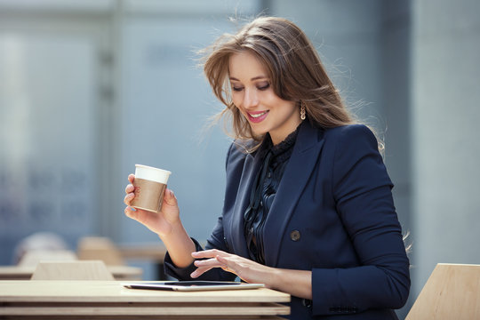 business woman working with tablet in cafe