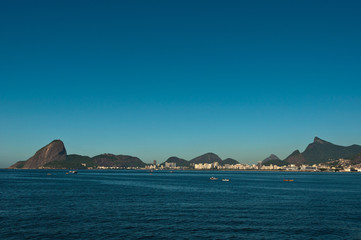 Rio de Janeiro City Skyline with its Hills in the Blue Sky